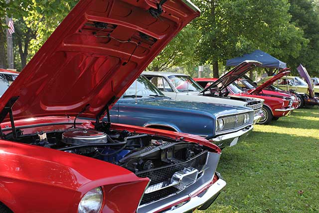 red classic car open hood