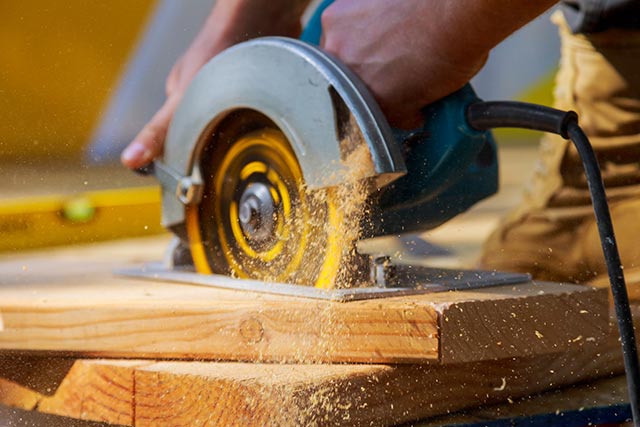 A handy person using a circular saw